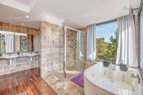 Bathroom with hot tub