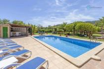 Beautiful pool, with sun loungers, near the covered rustic pool bar